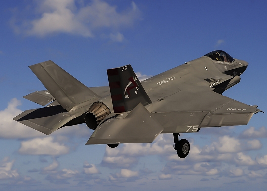 ATLANTIC OCEAN (Aug. 20, 2016) An F-35C Lightning II carrier variant, assigned to the Salty Dogs of Air Test and Evaluation Squadron (VX) 23, flies above the aircraft carrier USS George Washington (CVN 73). (U.S. Navy photo by Mass Communication Specialist 3rd Class Wyatt L. Anthony)