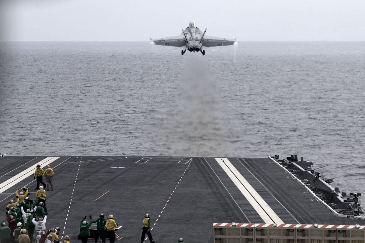 Lt. Cmdr. Jamie Struck, a test pilot from Air Test and Evaluation Squadron (VX) 23 at NAS Patuxent River, flying Salty Dog 123, an F/A-18F, was the first pilot to launch from CVN 78 using the new Electromagnetic Aircraft Launch System (EMALS) July 28. (U.S. Navy photo)