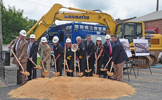 Pictured from left are Commissioner Vice President Evan Slaughenhoupt Jr., Commissioner Mike Hart, Commissioner Steve Weems, Prince Frederick Volunteer Rescue Squad Life Member and Board of Directors President Clarke Rawlings, Chief Stanis Inscoe, Life Member Sonny Brady and Commissioner Pat Nutter, with Commissioner President Tom Hejl between Dina and Joe Markakis from Whitney, Bailey Cox & Magnani, LLC Architects.