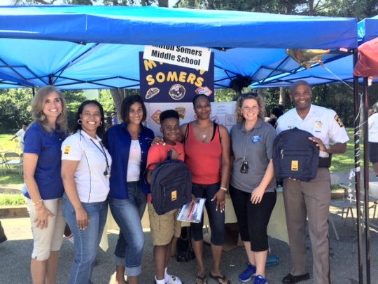 Milton M. Somers Middle School participated in the Kent Avenue Partnership third annual Community Block Party Aug. 19 at Caroline Park in La Plata. Spearheaded by La Plata Police Chief Carl Schinner, the event featured local groups and organizations, local law enforcement, amusements and music. The party allowed everyone to celebrate the end of summer and start to a new school year together. Education Systems Federal Credit Union provided backpacks with free school supplies. Somers' administration intern Sonia Matthew and Pam Jenkins, a pupil personnel worker at Somers, provided information about school bus safety and extracurricular opportunities for students. Pictured from left are La Plata Mayor Jeannine James, Latisha Chase of Educational Systems Federal Credit Union, Matthew, Kameron Taylor, a Somers seventh grader, Somers parent Curtney Taylor, Jenkins and Charles County Sheriff Troy Berry.