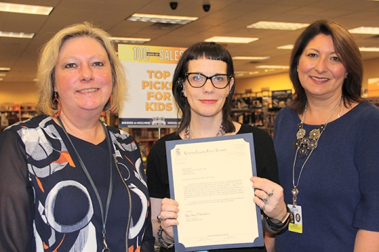 Books-A-Million donated more than 480 books for Charles County Public Schools students who are homeless or in foster care. Pictured from left are Meighan Hungerford, acting director of elementary instruction for CCPS, Books-A-Million co-manager Allie Petherick and Bethany Goodwin, youth in transition coordinator for CCPS.