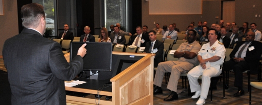 KING GEORGE, Va. (Sept. 26. 2017) - Dr. Marty Irvine - director of systems engineering at the Deputy Assistant Secretary of the Navy for Research, Development, Test and Evaluation - speaks during the Electromagnetic Maneuver Warfare (EMW) Systems Engineering and Acquisition Conference sponsored by the Association of Old Crows and Naval Surface Warfare Center Dahlgren Division (NSWCDD). Industry, academia, and Department of Defense experts discussed the advancement of electromagnetic warfare throughout the three-day event. Conference attendees toured NSWCDD labs and collaborated with the scientists and engineers behind the command's strategic thrusts and its electromagnetic and sensor systems technologies. NSWCDD strategic thrusts - electric weapons, mission engineering and analysis, and cyber warfare engineering - coupled with the command's technical expertise in the fields of spectrum management, electromagnetics, electronic warfare, and surface Navy radars are crucial to the Navy's development and integration of capabilities to enable EMW. (U.S. Navy photo/Released)