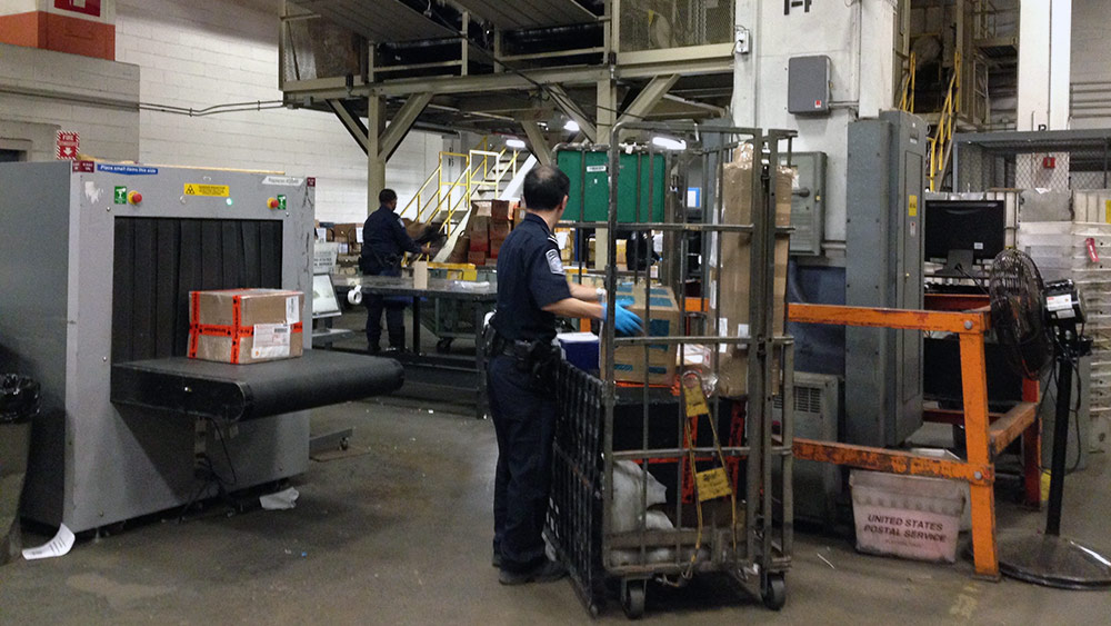 NEW YORK - At a facility at John F. Kennedy International Airport, U.S. customs officers inspect all international mail using X-ray machines. (Photo: Ashley Clarke)