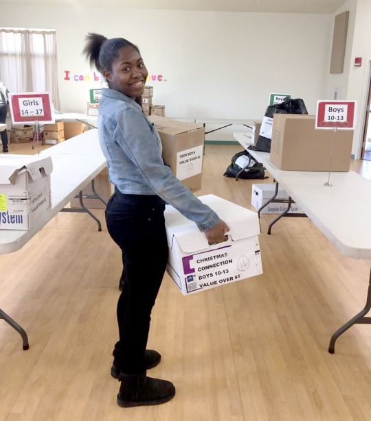 Members of the Westlake High School Key Club volunteered last month during the Charles County Children's Aid Society's Christmas Toy Connection. Along with other volunteers and members of the Charles County Sheriff's Office, the students helped to collect and organize donations. The club includes 27 students with six officers. Pictured is Westlake senior Kamryn Tross as she helps to organize items for the program.