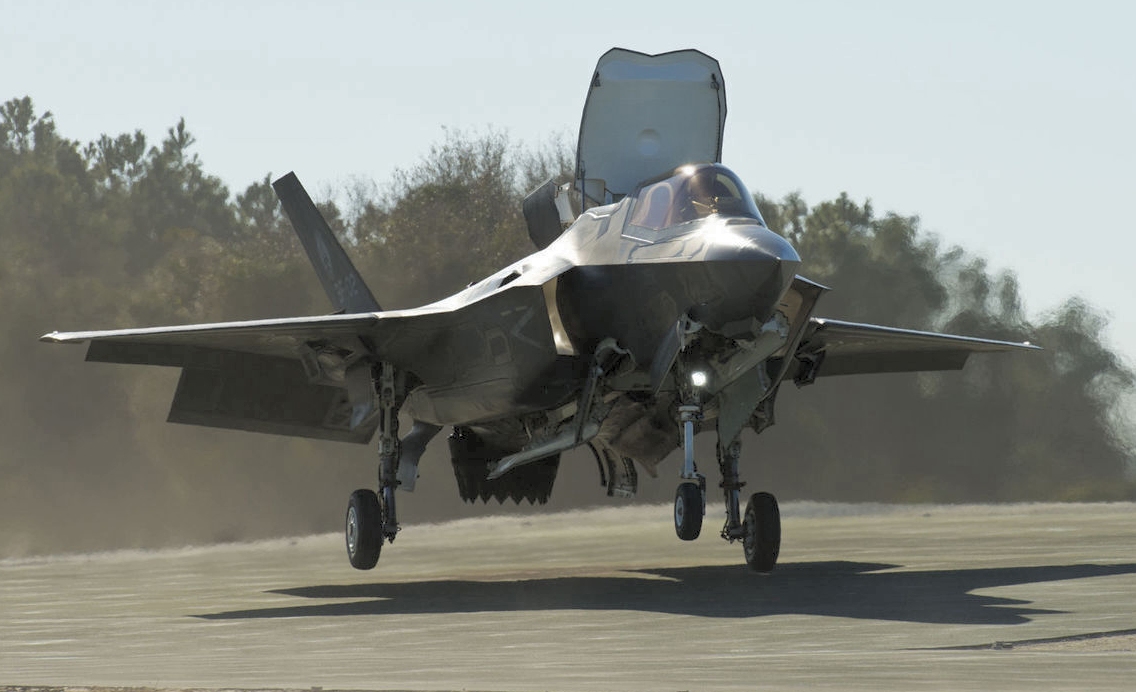 The Marine Corps' F-35 variant makes a vertical landing Jan. 16 at Marine Corps Auxiliary Landing Field Bogue, North Carolina, during sloped surface vertical landing testing. With the sloped surface tests, the F-35 Patuxent River Integrated Test Force team wraps up testing of the F-35B short takeoff/vertical landing envelope, bringing it one step closer to initial operational test and evaluation. Through a series of vertical landing maneuvers in simulated expeditionary conditions, the team's end goal is to expand warfighter capability for the F-35B, allowing vertical landings with relaxed sloped surface requirements. (Lockheed Martin photo by Dane Wiedmann)