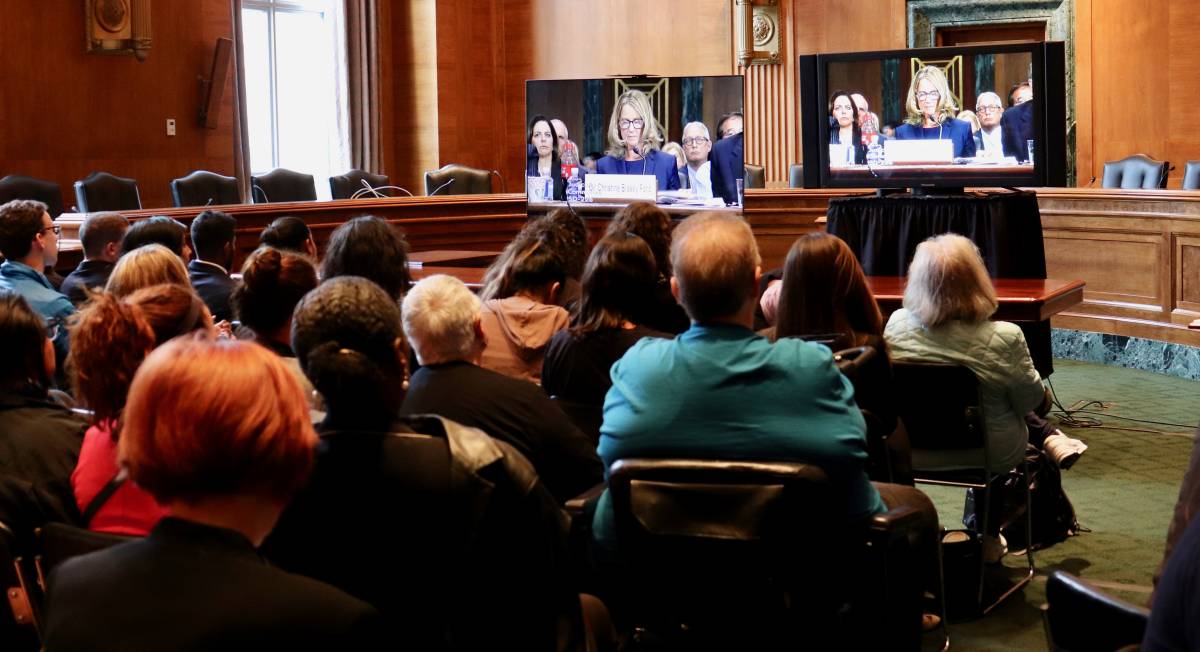 WASHINGTON - Members of the public sat silently watching television Thursday in an overflow room near the Senate Judiciary Committee hearing where Christine Blasey Ford detailed her sexual assault charges against Supreme Court nominee Brett Kavanaugh. (Photo: Albane Guichard)