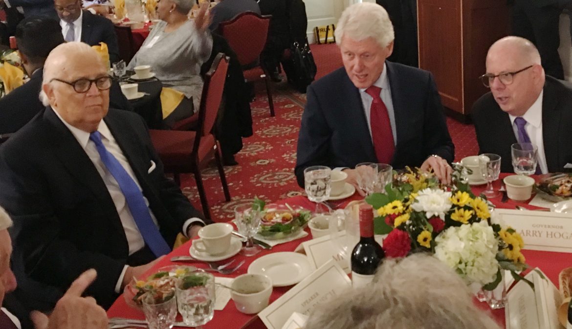 From left, corner, U.S. House Majority Leaders Steny Hoyer pointing, Maryland Senate President Mike Miller, former President Bill Clinton and Gov. Larry Hogan. MarylandReporter.com photo by Len Lazarick