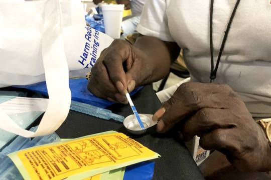 Belinda Barksdale of Bmore POWER, a harm reduction and opioid education group, demonstrates how to use a fentanyl test strip at a distribution event Wednesday, September 11, 2019, at Northeast Market in Baltimore. Cocaine-related deaths have spiked in recent years, due in large part to the proliferation of fentanyl, state health department figures show. (Photo: Ian Round)