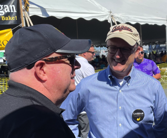 Libertarian Party gubernatorial candidate David Lashar, here talking with outgoing Republican Gov. Larry Hogan during a Crifield, Md., election event, said his campaign is to push the Republican Party more towards the center. (Courtesy of David Lashar)