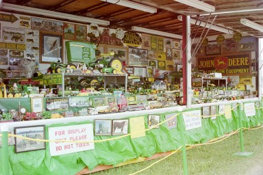 A display devoted to John Deere toy tractors and other collectibles.